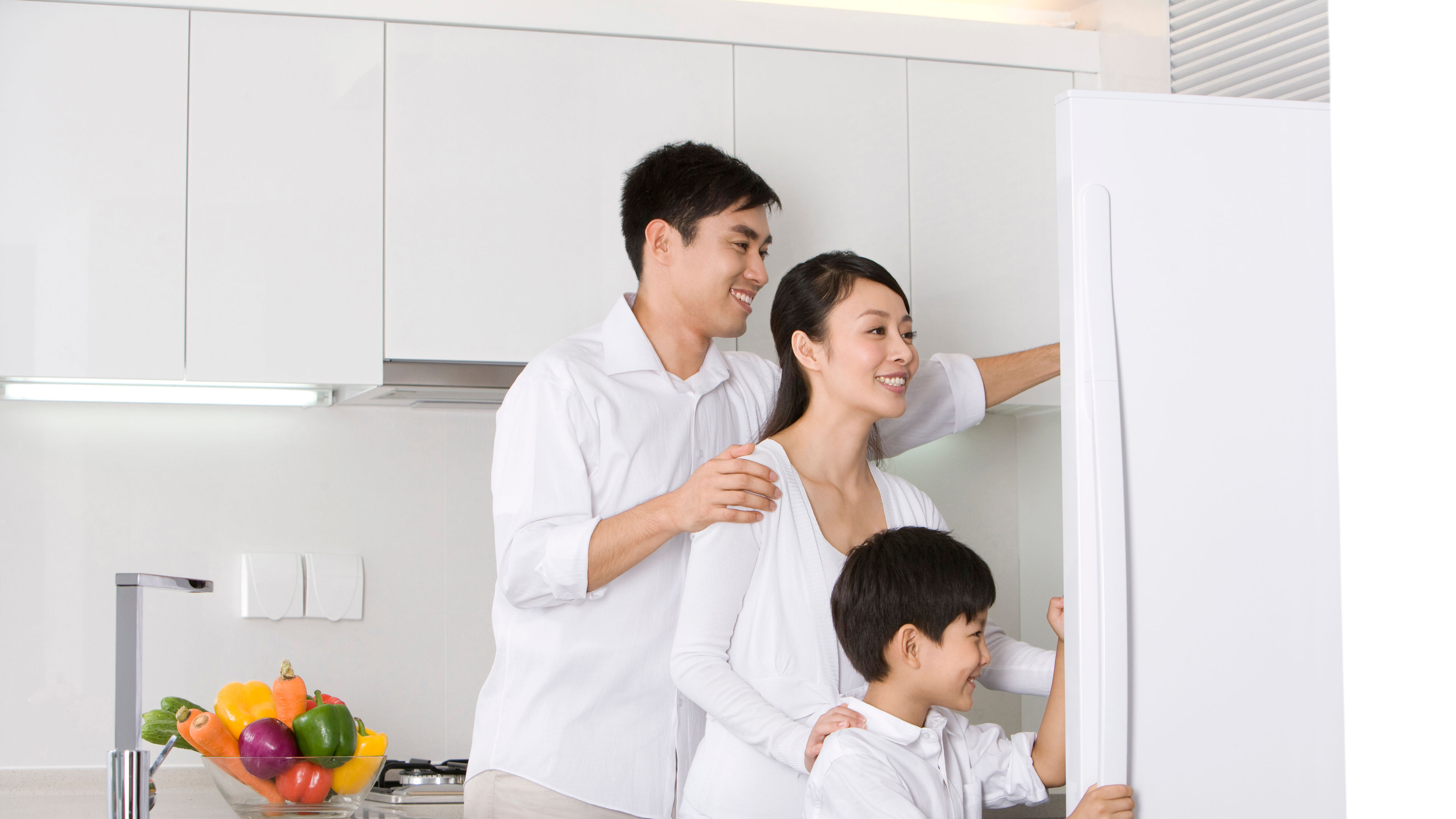 A family in a modern kitchen