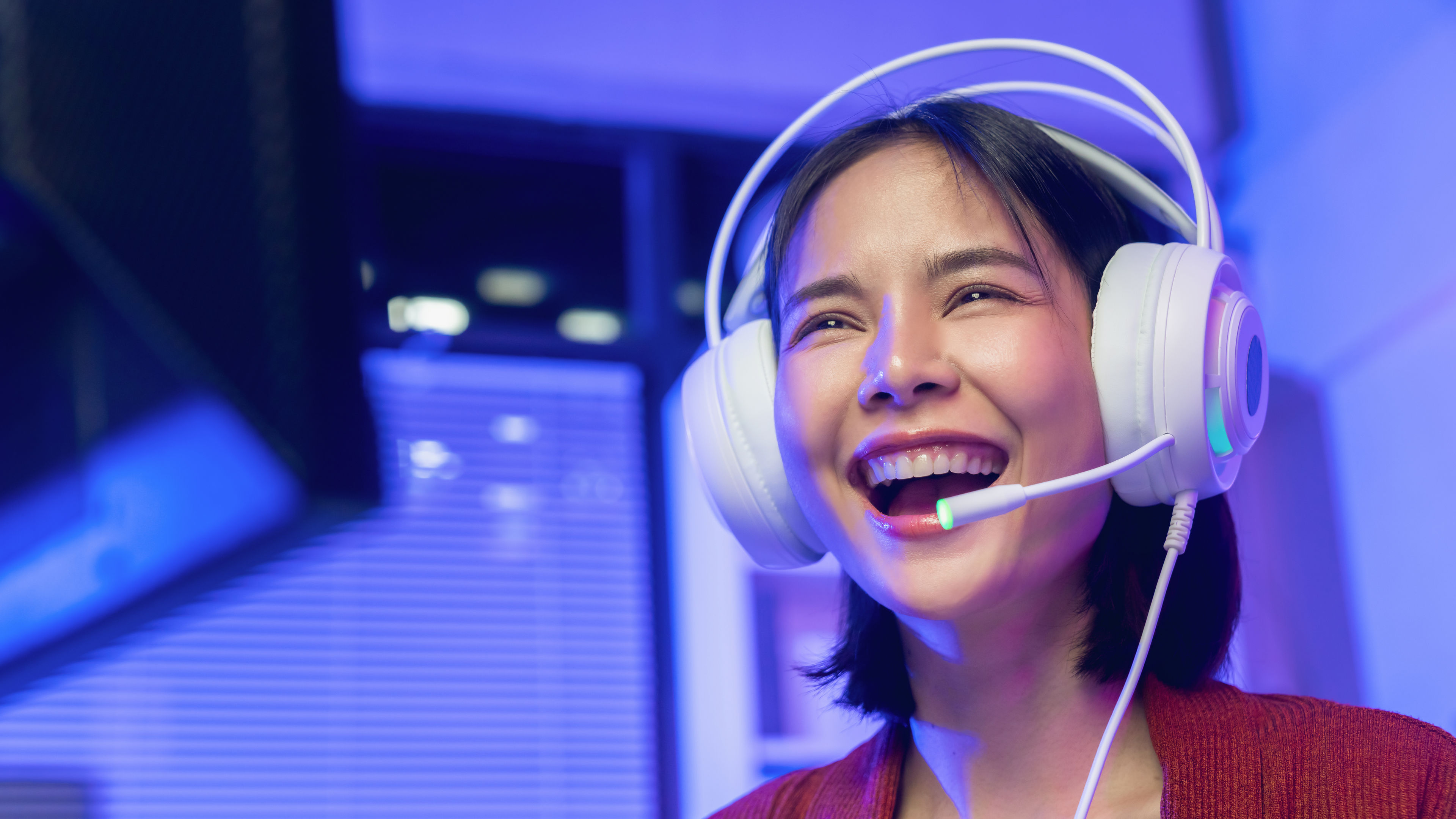 Cheerful Young Woman Wearing White Gaming Headset 